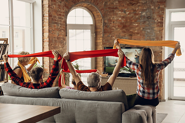 Image showing Excited, happy big family team watch sport match together on the couch at home