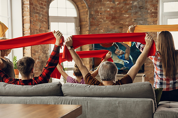 Image showing Excited, happy big family team watch sport match together on the couch at home