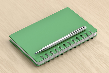 Image showing Green notebook and silver pen