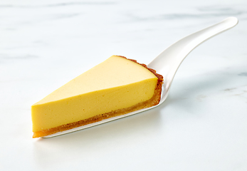 Image showing slice of fresh vegan mango cake