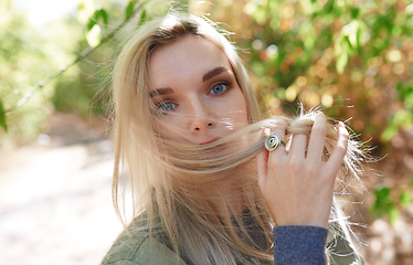 Image showing Young adult woman spending quality time in the forest