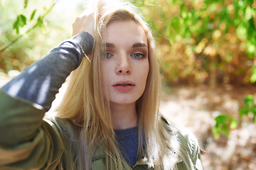 Image showing Young adult woman spending quality time in the forest