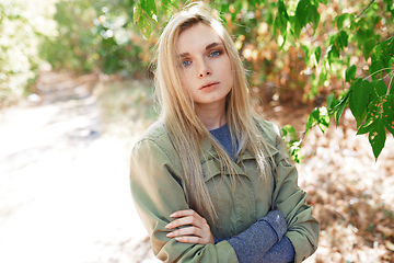 Image showing Young adult woman spending quality time in the forest