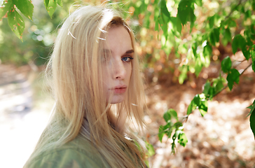 Image showing Young adult woman spending quality time in the forest