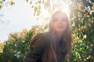 Image showing Young adult woman spending quality time in the forest