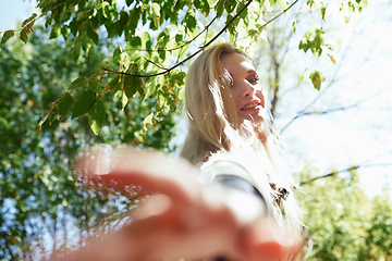 Image showing Young adult woman spending quality time in the forest