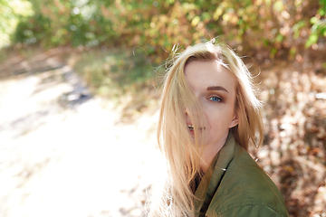 Image showing Young adult woman spending quality time in the forest