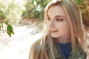 Image showing Young adult woman spending quality time in the forest