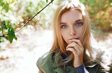 Image showing Young adult woman spending quality time in the forest