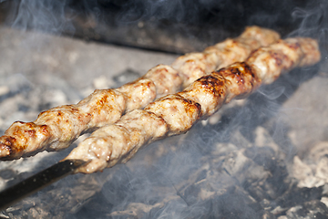 Image showing Cooking meat on the grill
