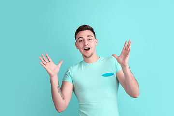 Image showing Caucasian young man\'s portrait on blue studio background