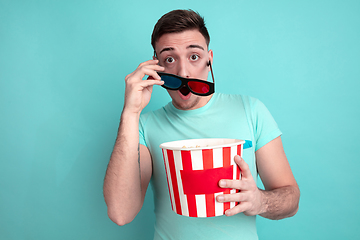 Image showing Caucasian young man\'s portrait on blue studio background