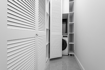 Image showing White laundry space inside wardobe room in new apartment