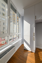 Image showing Empty heated penthouse living room with floor to ceiling windows