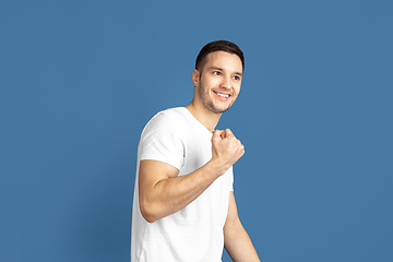 Image showing Caucasian young man\'s portrait on blue studio background