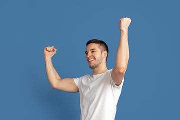 Image showing Caucasian young man\'s portrait on blue studio background