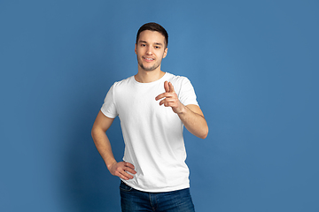 Image showing Caucasian young man\'s portrait on blue studio background