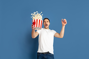 Image showing Caucasian young man\'s portrait on blue studio background