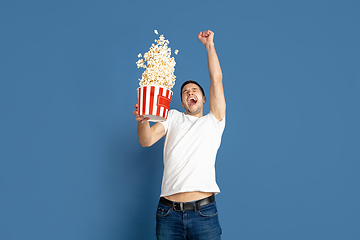 Image showing Caucasian young man\'s portrait on blue studio background