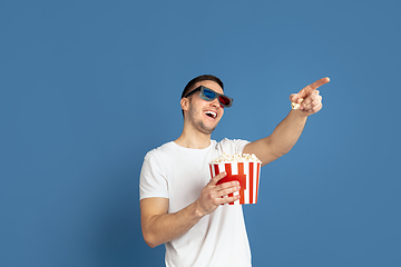 Image showing Caucasian young man\'s portrait on blue studio background