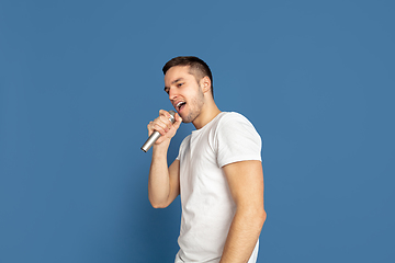 Image showing Caucasian young man\'s portrait on blue studio background