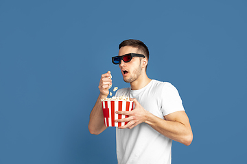 Image showing Caucasian young man\'s portrait on blue studio background