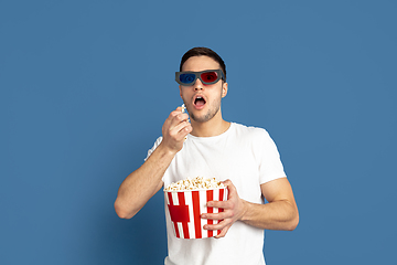 Image showing Caucasian young man\'s portrait on blue studio background