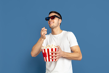 Image showing Caucasian young man\'s portrait on blue studio background