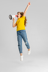 Image showing Happy kid, girl isolated on white studio background. Looks happy, cheerful, sincere. Copyspace. Childhood, education, emotions concept