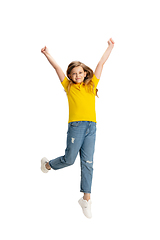 Image showing Happy kid, girl isolated on white studio background. Looks happy, cheerful, sincere. Copyspace. Childhood, education, emotions concept