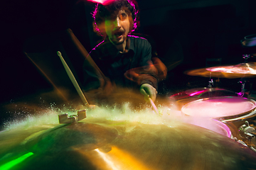 Image showing Drummer\'s rehearsing on drums before rock concert. Man recording music on drumset in studio