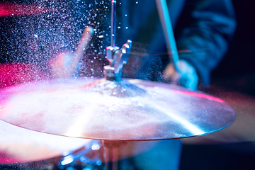 Image showing Drummer\'s rehearsing on drums before rock concert. Man recording music on drumset in studio