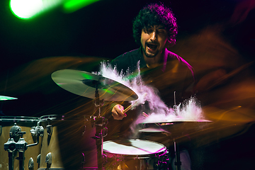 Image showing Drummer\'s rehearsing on drums before rock concert. Man recording music on drumset in studio