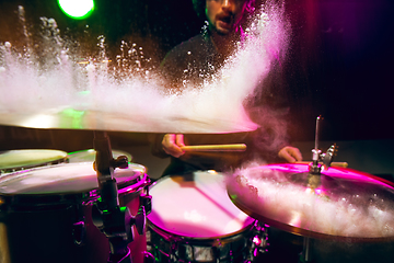 Image showing Drummer\'s rehearsing on drums before rock concert. Man recording music on drumset in studio