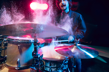 Image showing Drummer\'s rehearsing on drums before rock concert. Man recording music on drumset in studio