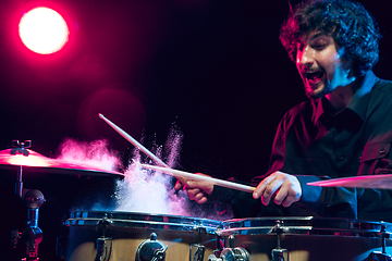 Image showing Drummer\'s rehearsing on drums before rock concert. Man recording music on drumset in studio