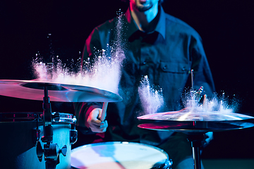 Image showing Drummer\'s rehearsing on drums before rock concert. Man recording music on drumset in studio