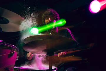 Image showing Drummer\'s rehearsing on drums before rock concert. Man recording music on drumset in studio