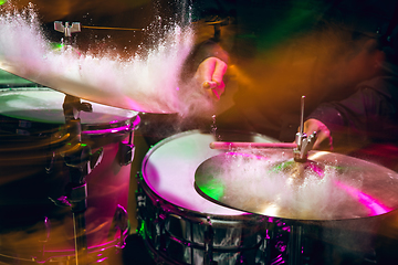 Image showing Drummer\'s rehearsing on drums before rock concert. Man recording music on drumset in studio