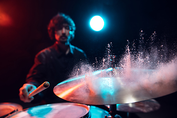 Image showing Drummer\'s rehearsing on drums before rock concert. Man recording music on drumset in studio