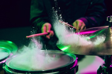 Image showing Drummer\'s rehearsing on drums before rock concert. Man recording music on drumset in studio