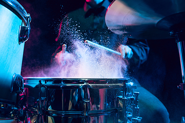 Image showing Drummer\'s rehearsing on drums before rock concert. Man recording music on drumset in studio