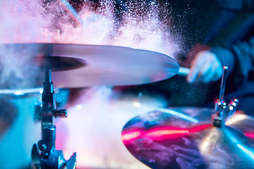 Image showing Drummer\'s rehearsing on drums before rock concert. Man recording music on drumset in studio