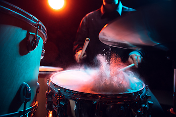 Image showing Drummer\'s rehearsing on drums before rock concert. Man recording music on drumset in studio