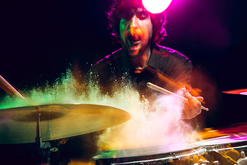 Image showing Drummer\'s rehearsing on drums before rock concert. Man recording music on drumset in studio