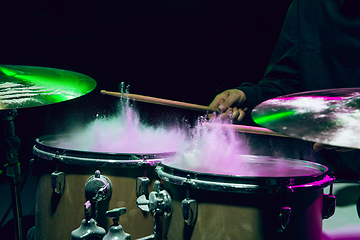 Image showing Drummer\'s rehearsing on drums before rock concert. Man recording music on drumset in studio