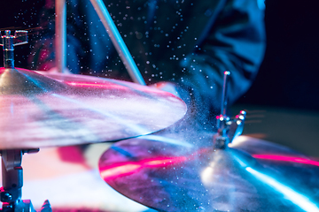 Image showing Drummer\'s rehearsing on drums before rock concert. Man recording music on drumset in studio