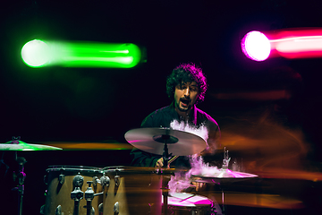 Image showing Drummer\'s rehearsing on drums before rock concert. Man recording music on drumset in studio