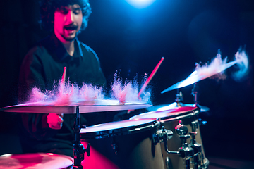 Image showing Drummer\'s rehearsing on drums before rock concert. Man recording music on drumset in studio