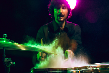 Image showing Drummer\'s rehearsing on drums before rock concert. Man recording music on drumset in studio